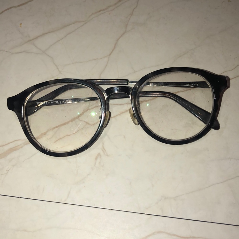 Titus prescription round tortoise glasses.